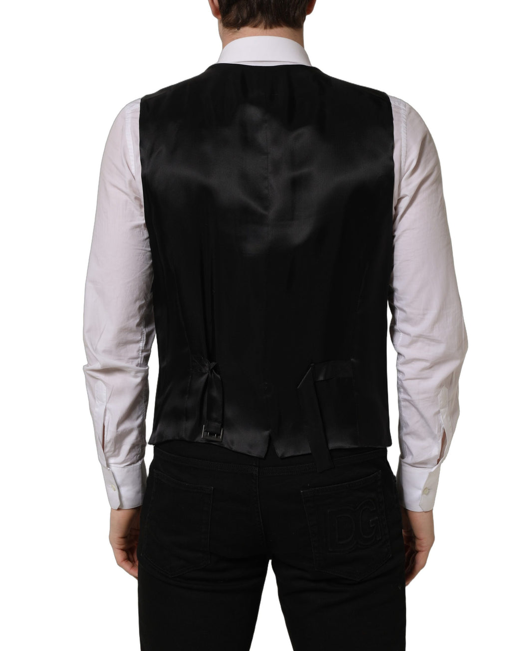 Gilet en laine noire Dolce & Gabbana à une seule rangée de boutons, coupe élégante et classique, porté sur un mannequin.