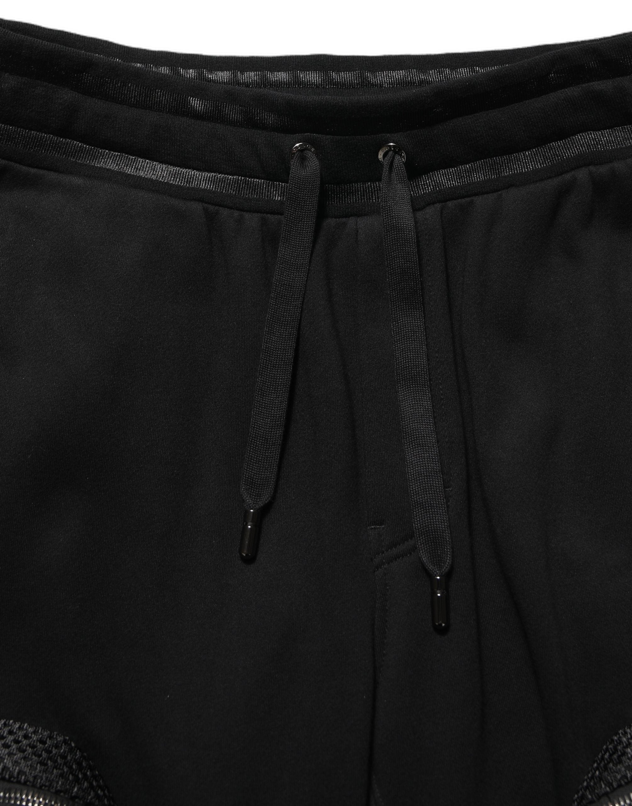 Pantalons cargo joggers Dolce & Gabbana noirs à taille mi-haute, style décontracté avec poches latérales et ceinture ajustable.