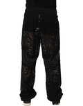 Pantalon jogger homme Dolce & Gabbana en dentelle noire, taille mi-haute, style élégant et décontracté.