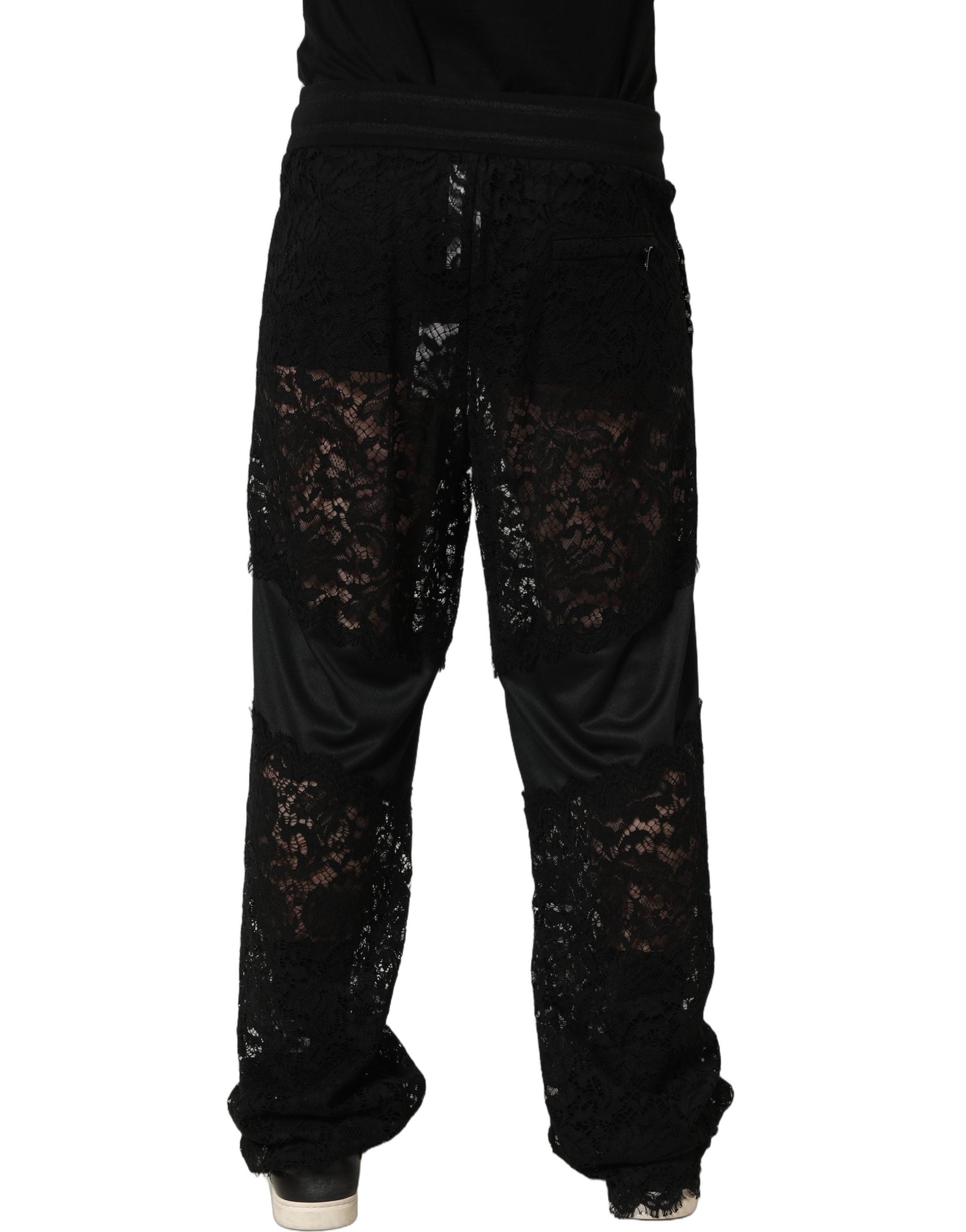 Pantalon jogger homme Dolce & Gabbana en dentelle noire, taille mi-haute, style élégant et décontracté.