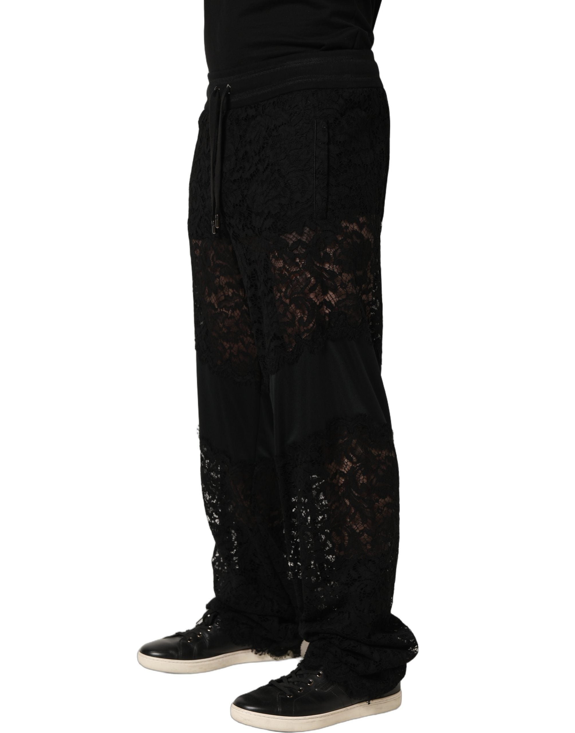 Pantalon jogger noir Dolce & Gabbana pour homme en dentelle, taille mi-haute, style élégant et décontracté.