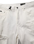 Jeans droits en denim blanc Dolce & Gabbana en coton avec déchirures, style décontracté et tendance.