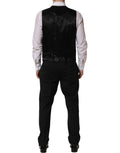 Costume homme noir en laine Dolce & Gabbana, costume trois pièces ajusté pour occasions formelles, élégant et sophistiqué.