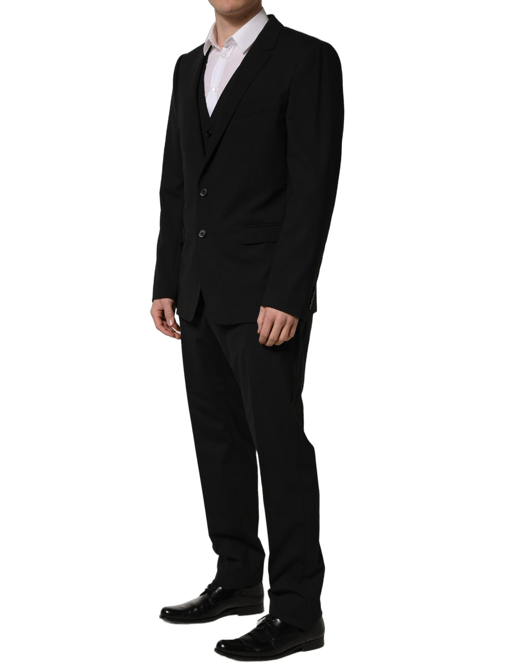 Costume homme 3 pièces en laine noire Dolce & Gabbana, coupe ajustée et élégante, idéal pour les occasions formelles.