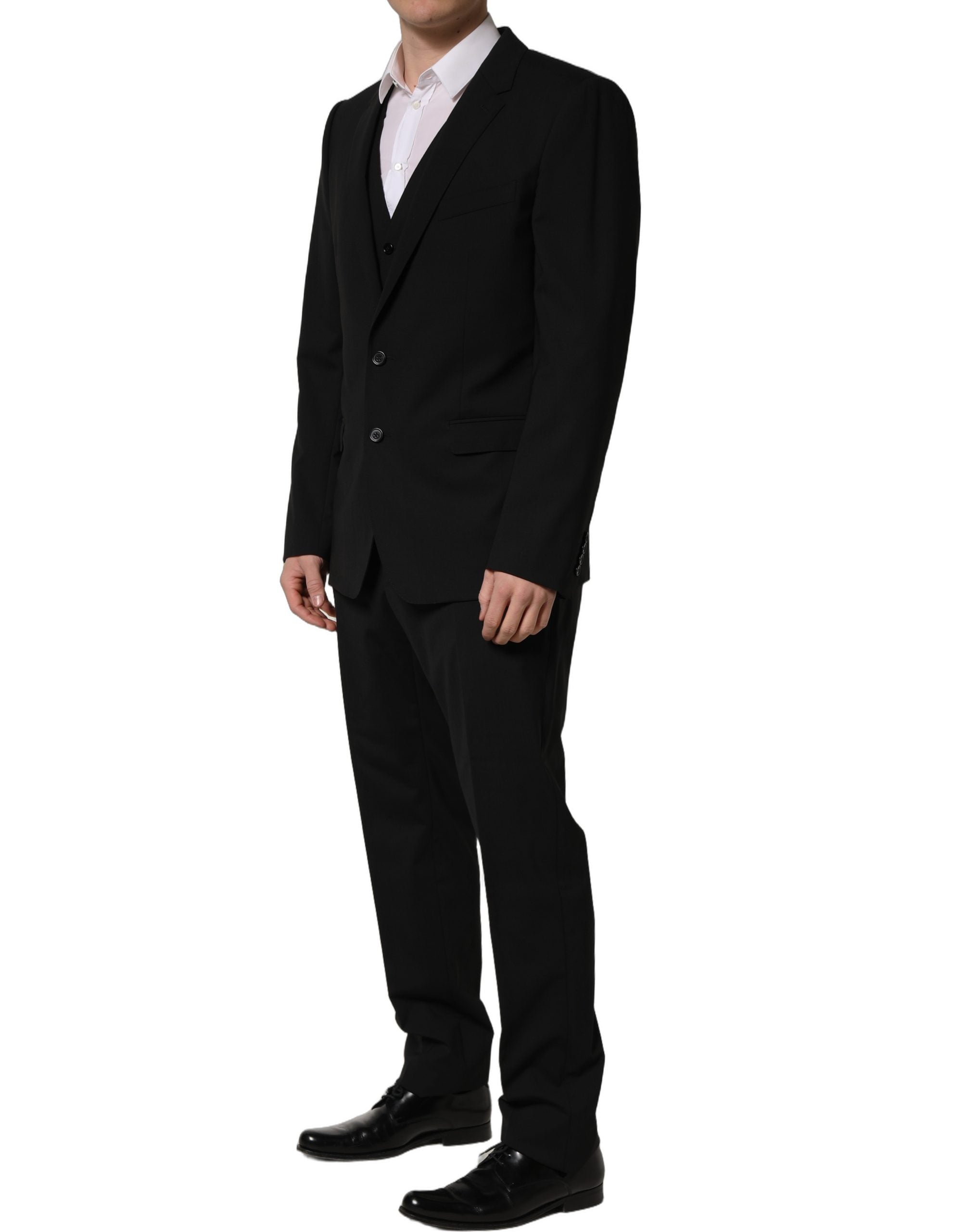 Costume homme 3 pièces en laine noire Dolce & Gabbana, coupe ajustée et élégante, idéal pour les occasions formelles.