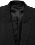Costume homme Dolce & Gabbana en laine noire, deux pièces, coupe slim, costume formel élégant avec veste et pantalon.