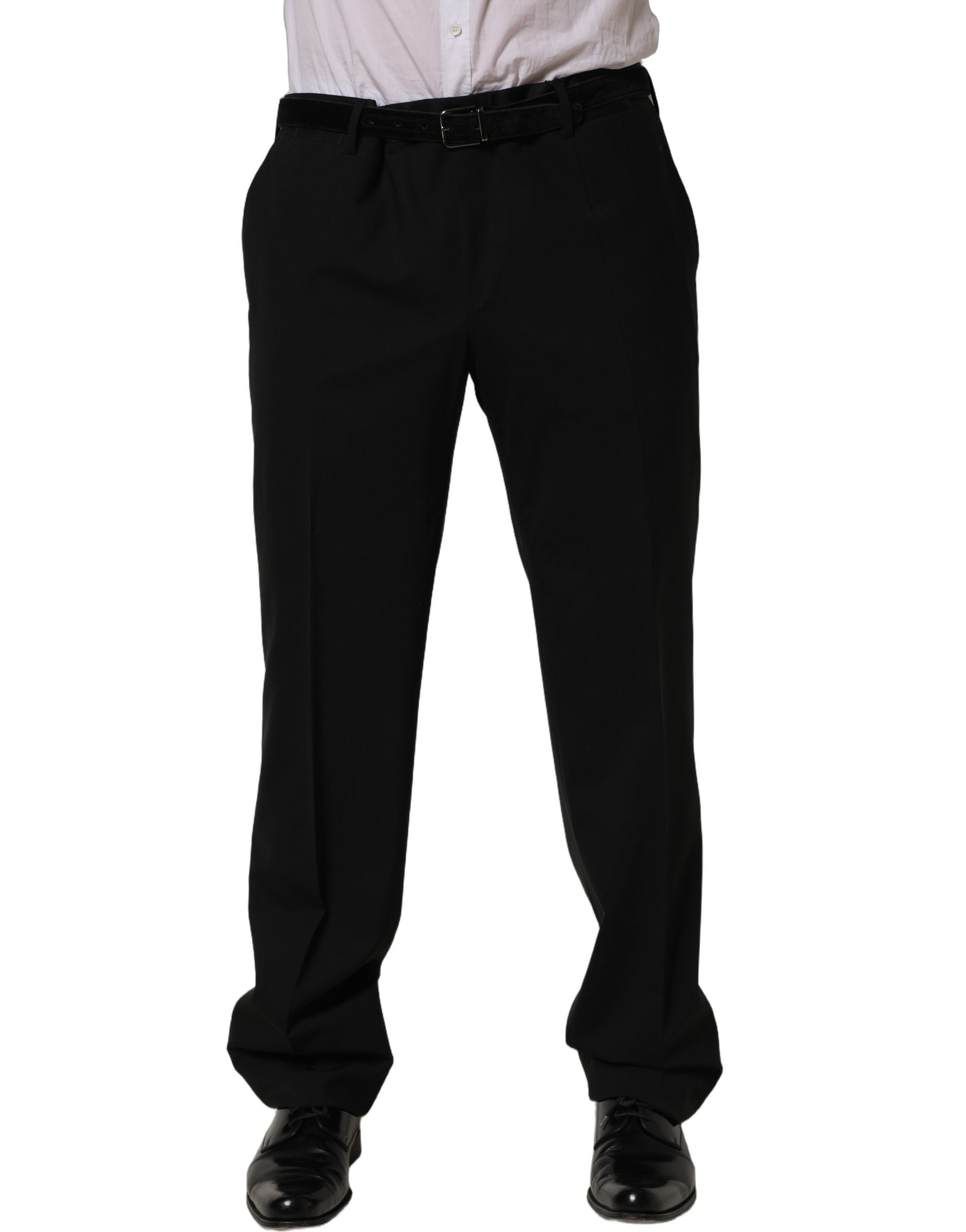 Pantalon de costume noir en laine Dolce & Gabbana, coupe tapered, avec ceinture élégante et finition soignée.
