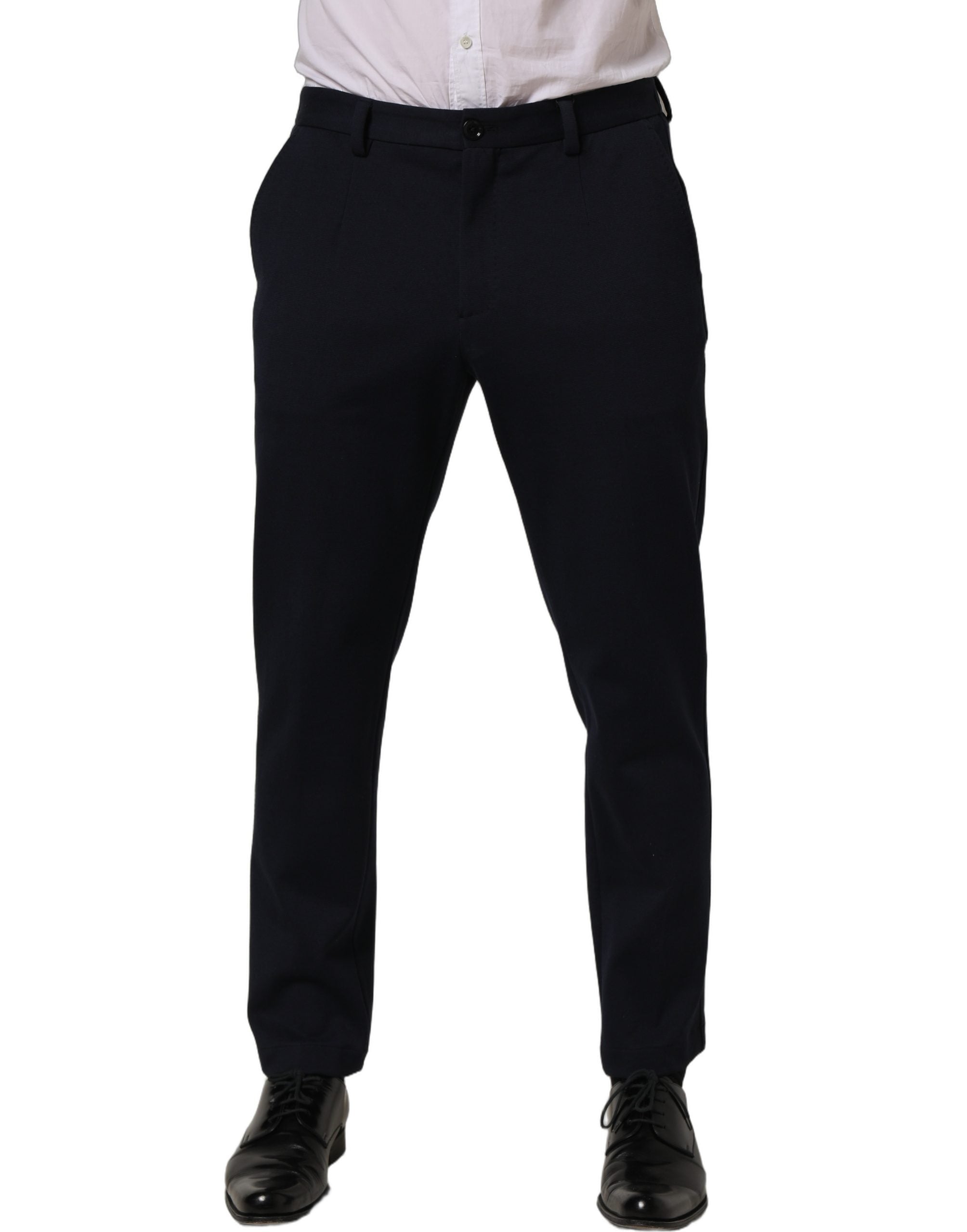 Pantalon habillé en coton noir de coupe tapered par Dolce & Gabbana, vue de face, avec détails élégants et ceinture ajustable.
