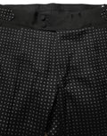 Pantalon en coton noir à pois Dolce & Gabbana, robe pantalon élégante avec motif à pois, vue de devant.
