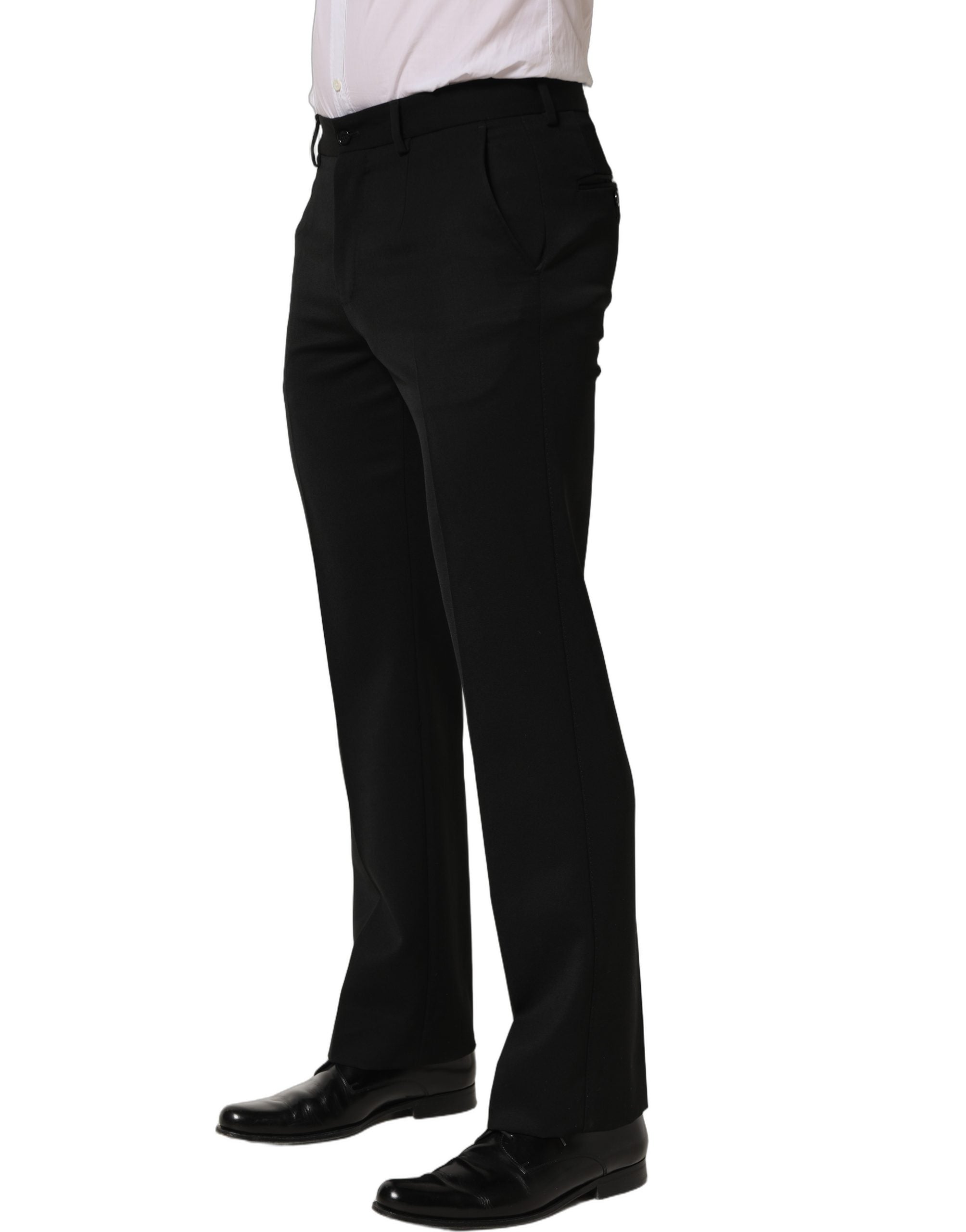Pantalon homme Dolce & Gabbana en laine noire, coupe tapered, pantalon de costume élégant avec ceinture et poches.