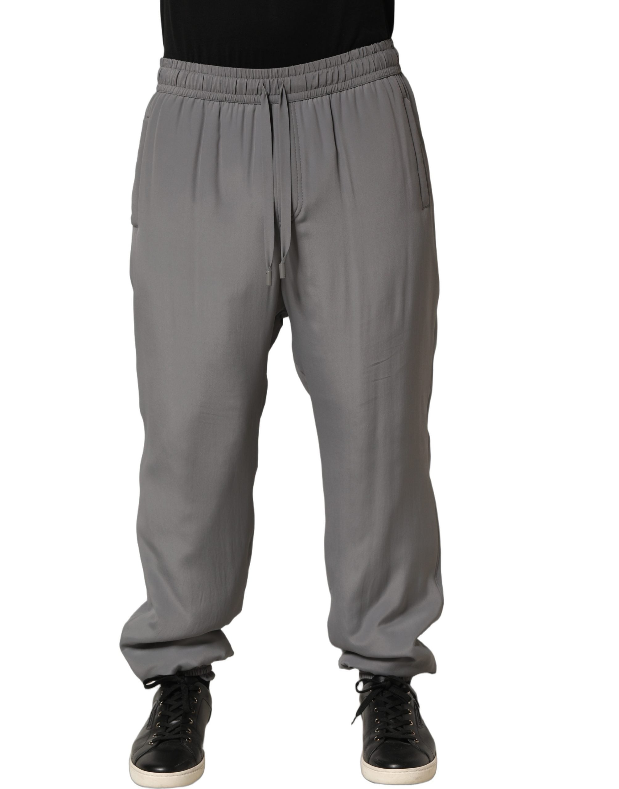 Pantalon de jogging en coton gris Dolce & Gabbana, style décontracté, avec ceinture élastique et poches latérales.