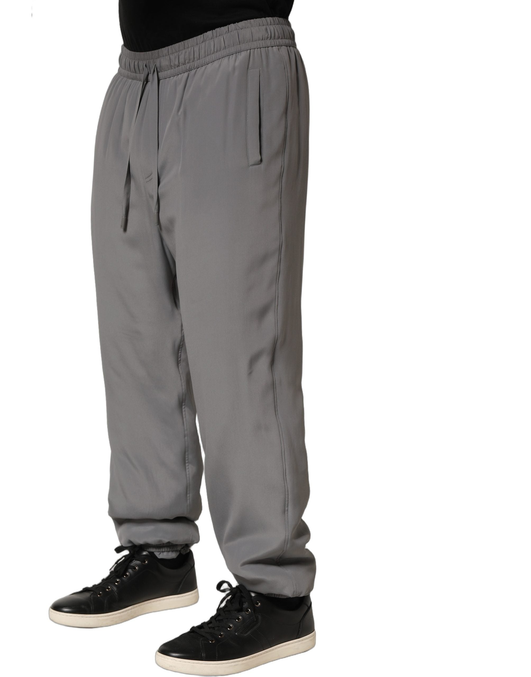 Pantalon jogger Dolce & Gabbana gris en coton avec ceinture élastique et poches latérales, pantalon de style décontracté.