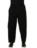 Pantalon homme Dolce & Gabbana noir taille moyenne, coupe droite, en tissu élégant et classique sur un mannequin.