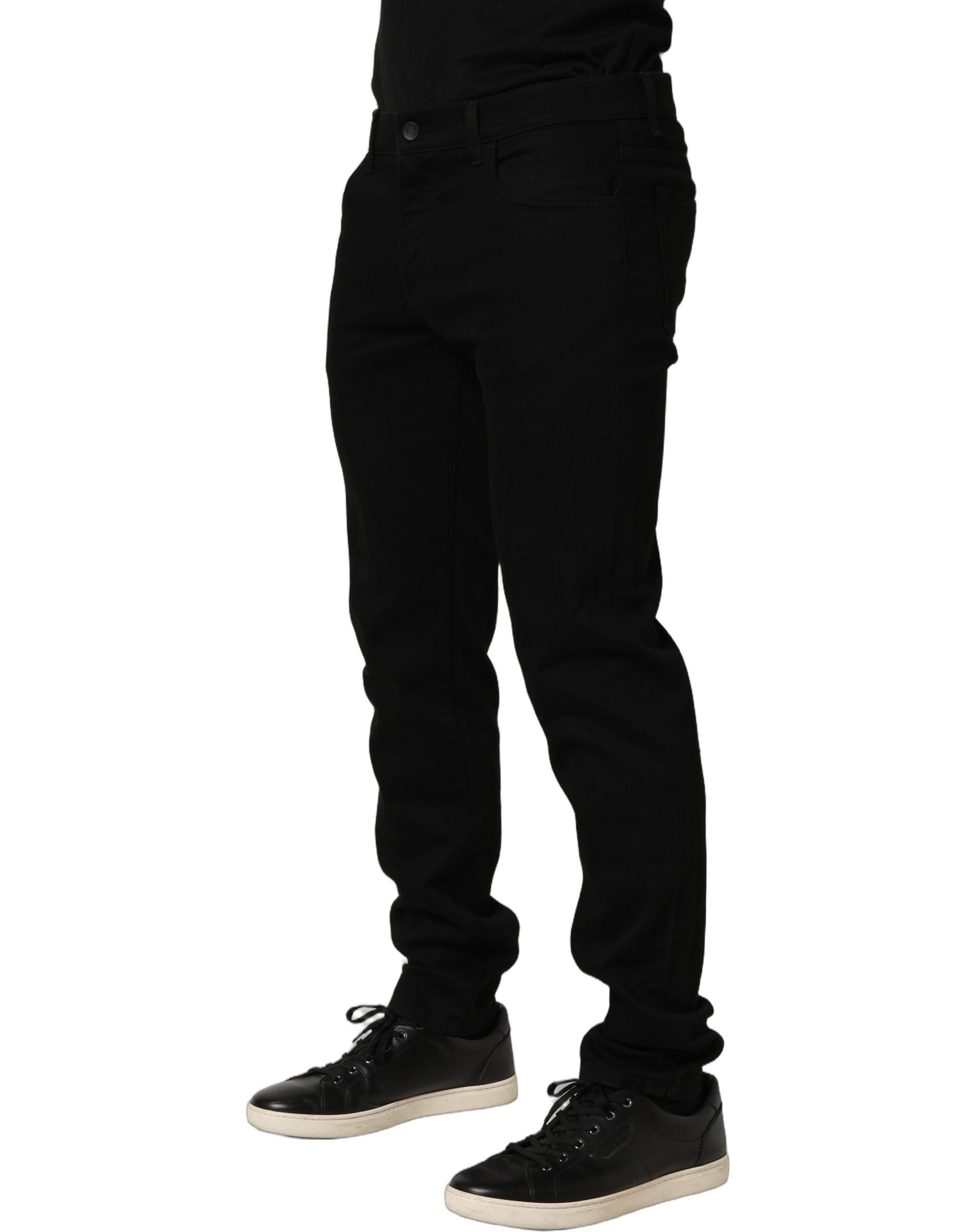 Jean skinny en coton stretch noir pour homme de Dolce & Gabbana, coupe ajustée, visible en détail dans l'image.