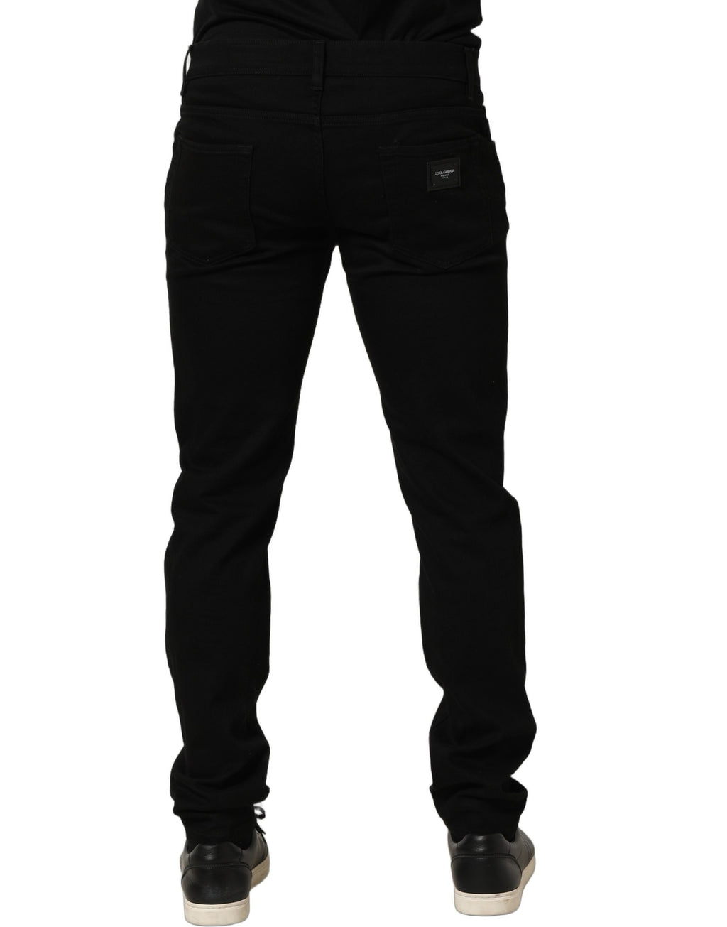 Jeans slim en coton stretch noir Dolce & Gabbana pour homme, coupe skinny, détail de couture visible.