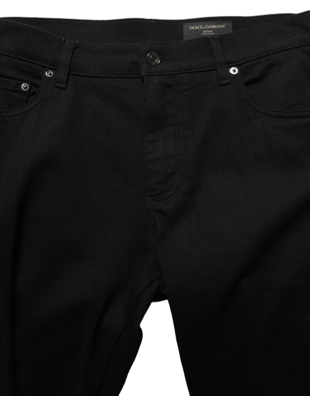 Jeans skinny pour homme en coton stretch noir de Dolce & Gabbana, denim ajusté et élégant, visibles en détail dans l’image.