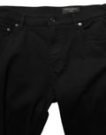 Jeans skinny pour homme en coton stretch noir de Dolce & Gabbana, denim ajusté et élégant, visibles en détail dans l’image.