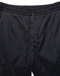 Pantalon de jogging noir en nylon Dolce & Gabbana, coupe droite, style décontracté avec poches latérales et taille élastique.