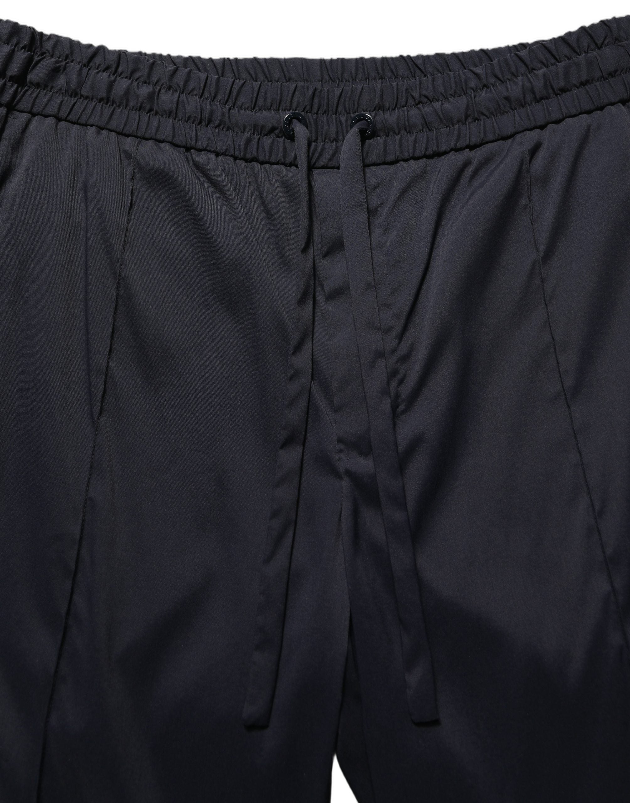 Pantalon de jogging noir en nylon Dolce & Gabbana, coupe droite, style décontracté avec poches latérales et taille élastique.