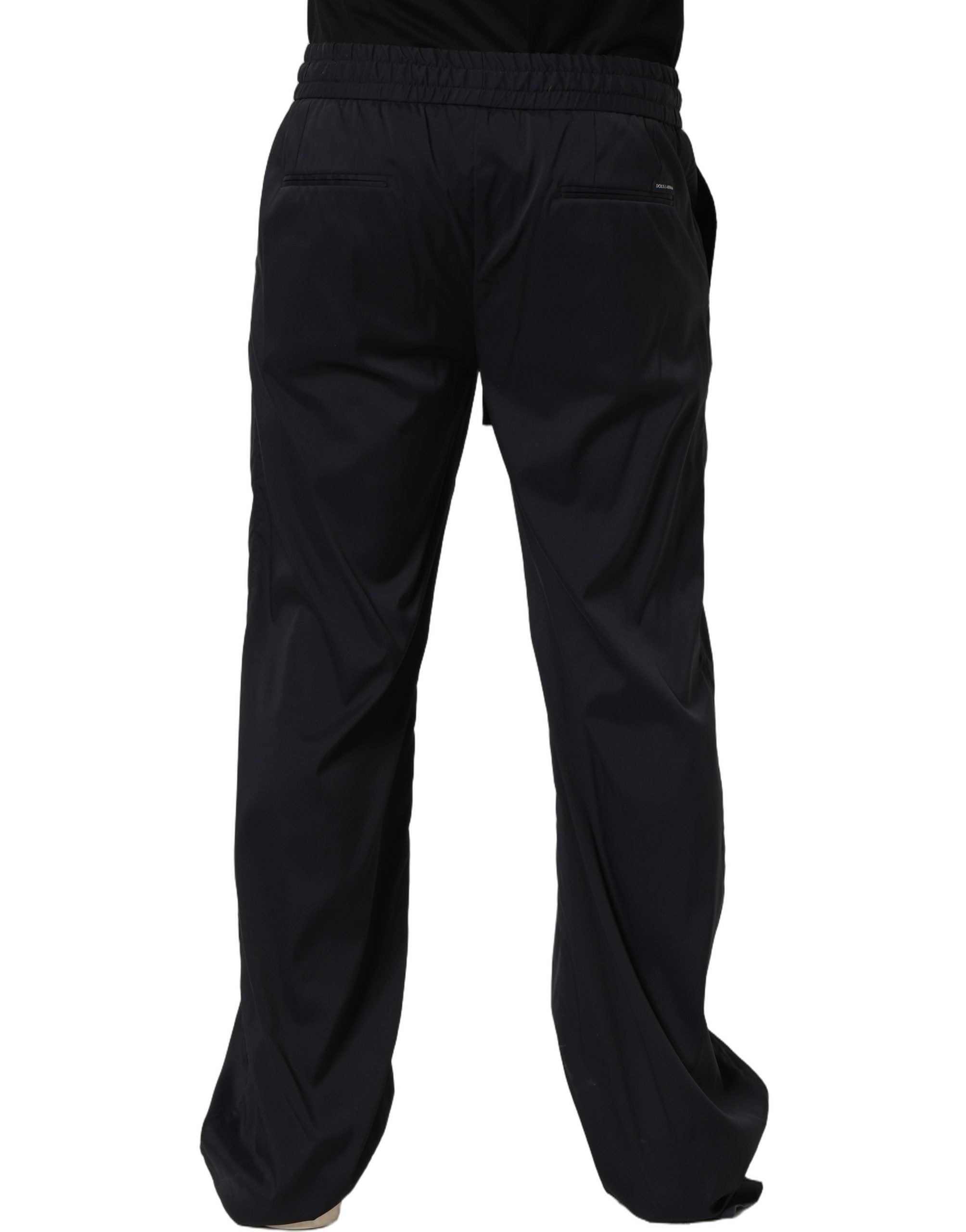 Pantalon de jogging noir en nylon Dolce & Gabbana, coupe droite, style décontracté et confortable, visible en détail dans l'image.