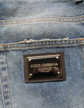 Jeans en denim droit bleu Dolce & Gabbana, coton déchiré, style décontracté, visible sur l'image.