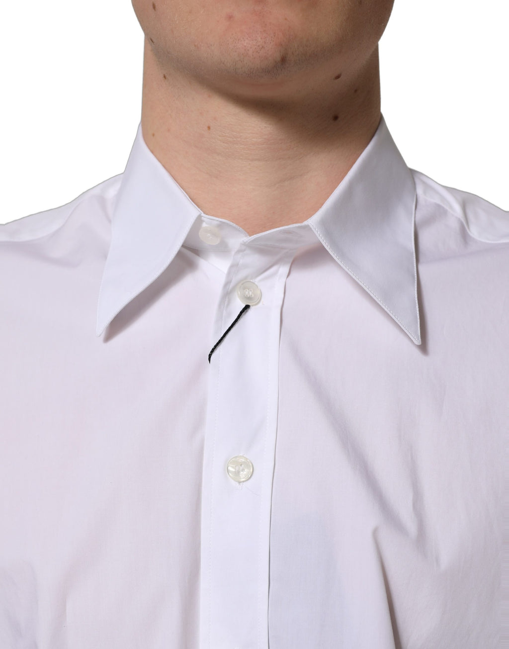 Chemise formelle sans manches Dolce & Gabbana en coton blanc, élégante et classique, visible avec col et boutons.