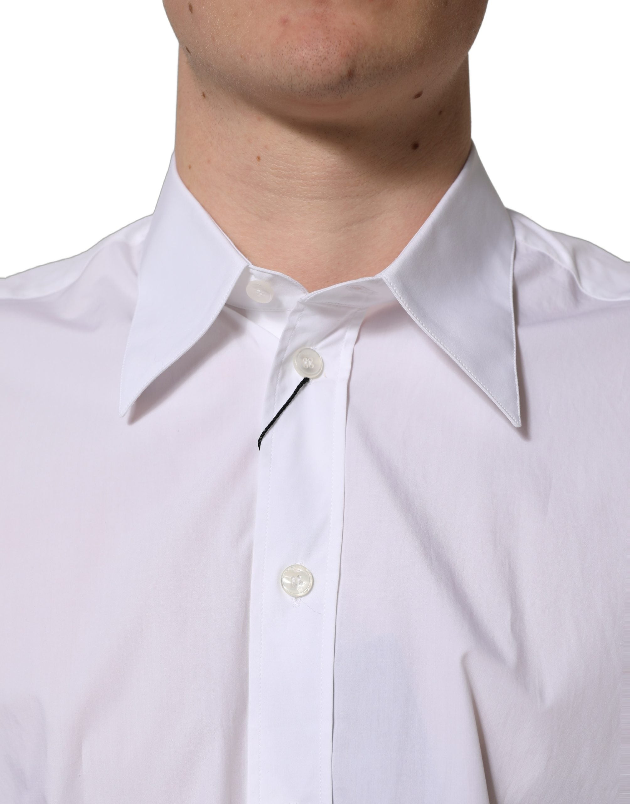 Chemise formelle sans manches Dolce & Gabbana en coton blanc, élégante et classique, visible avec col et boutons.
