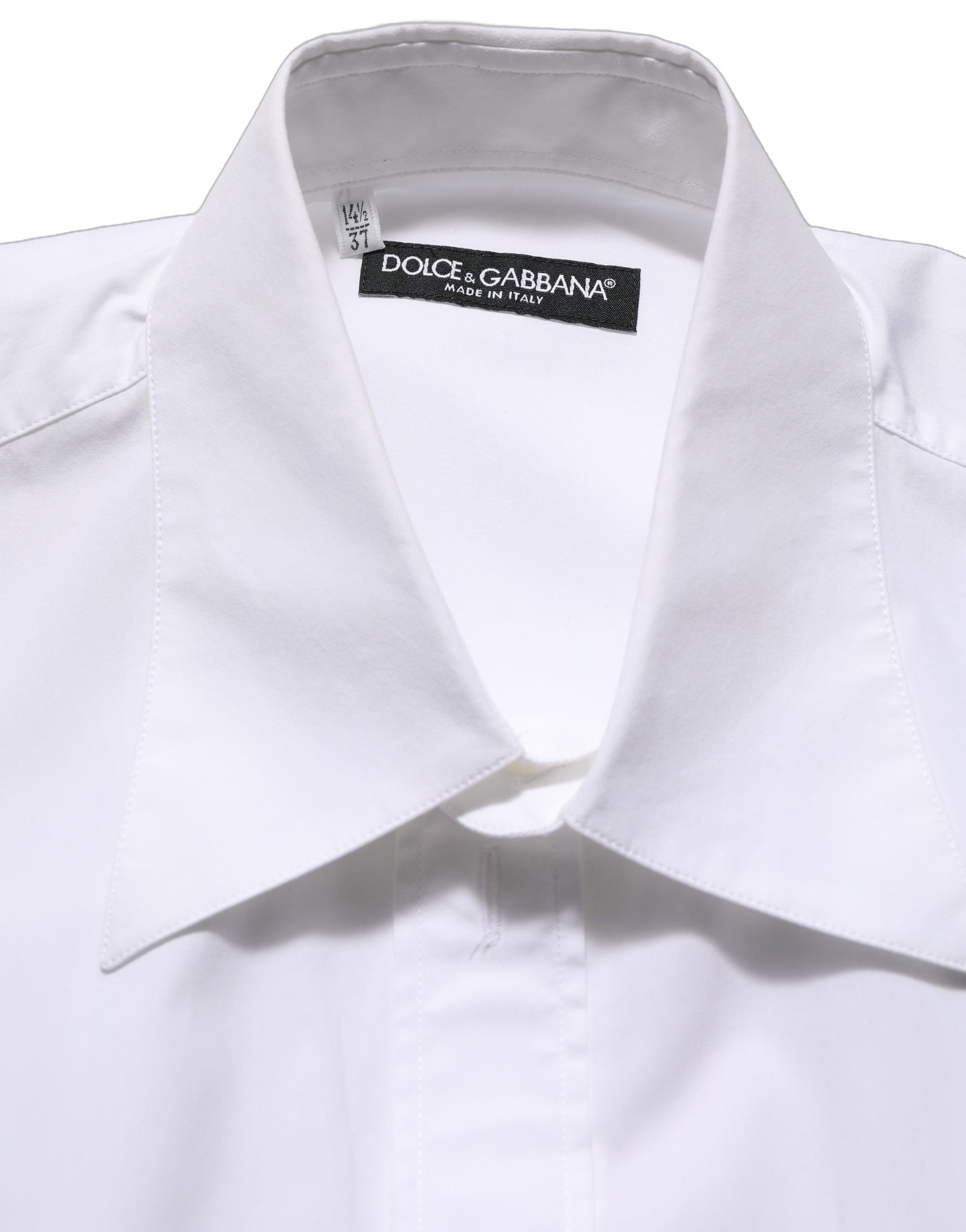 Chemise blanche en coton sans manches de costume Dolce & Gabbana, boutonnière élégante et finition soignée visible sur l'image.