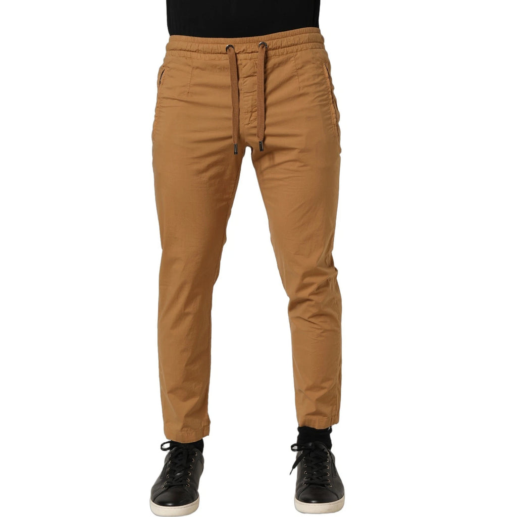 Pantalon jogger Dolce & Gabbana marron, taille mi-haute, coupe skinny, en tissu confortable, vue de face.