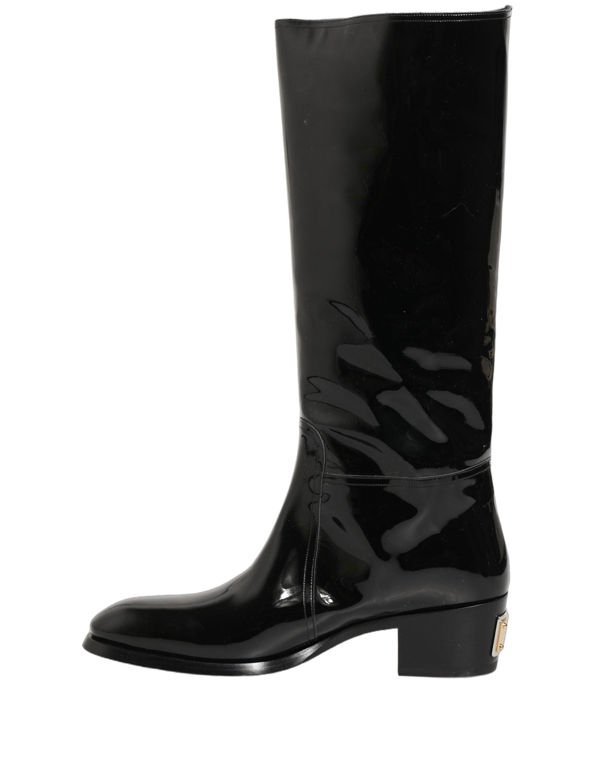 Chaussures bottines en cuir noir Dolce & Gabbana, talons hauts, longues bottes jusqu'aux genoux, style élégant et sophistiqué.