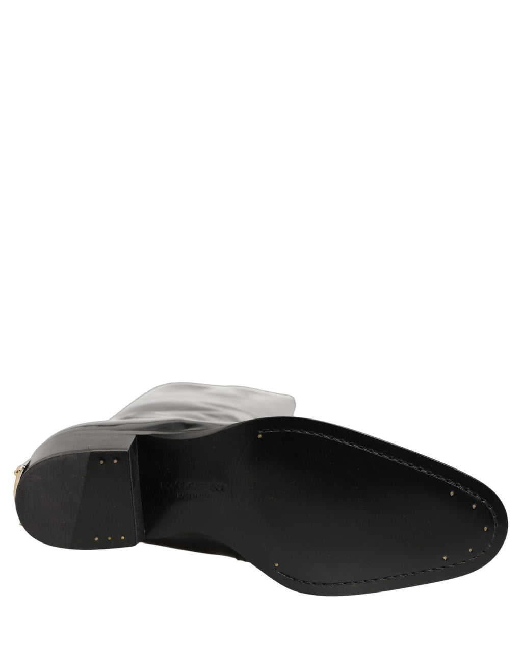 Chaussures bottines en cuir noir Dolce & Gabbana, talons hauts et genou, élégantes et sophistiquées pour femmes.