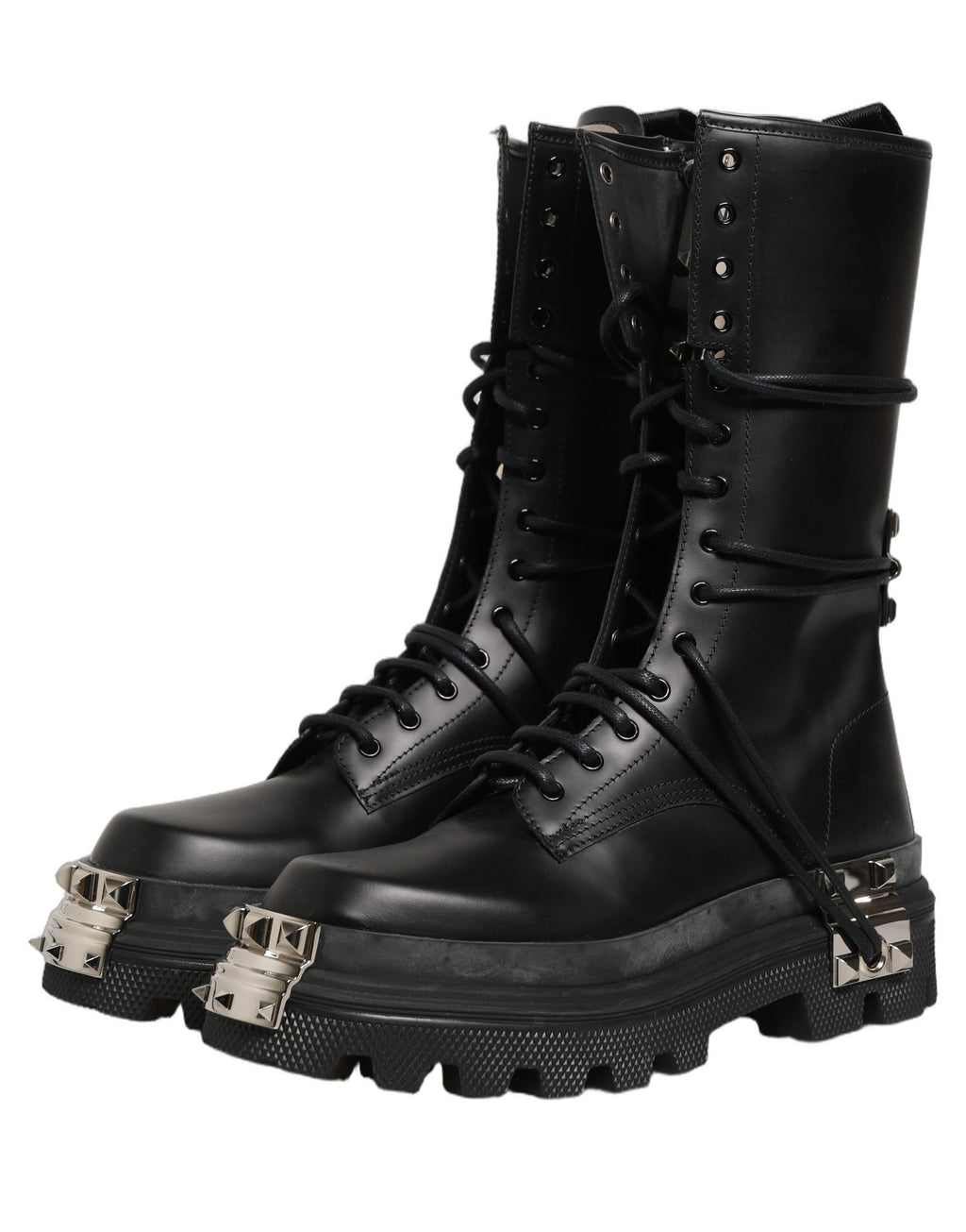 Bottes combat à plateforme noires Dolce & Gabbana avec studs, talons hauts et design audacieux, en cuir brillant.