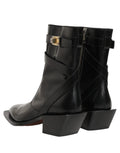 Bottes en cuir noir Dolce & Gabbana avec plaque DG, mi-mollet, style élégant et sophistiqué, vue de face.