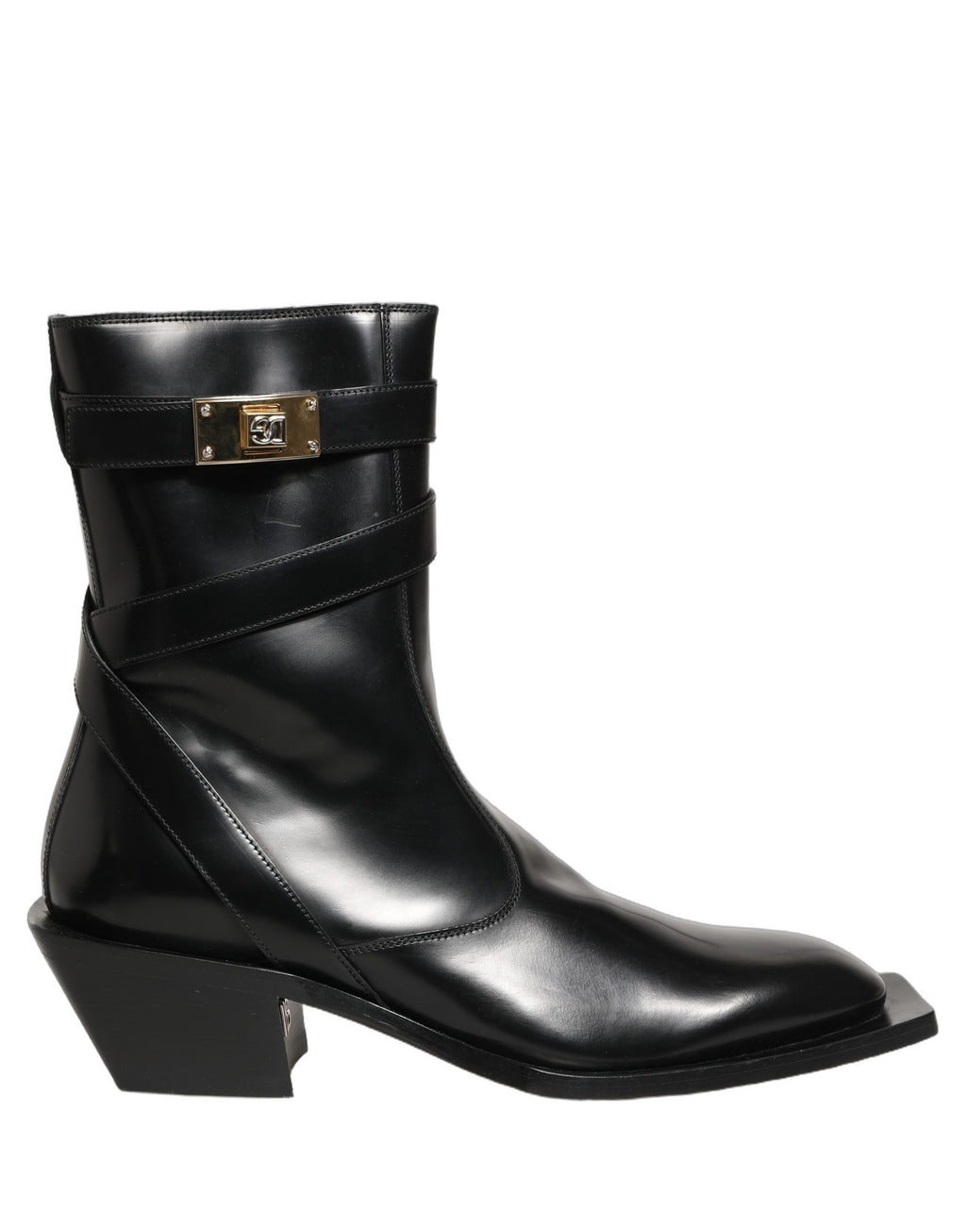 Bottes en cuir noir Dolce & Gabbana avec plaque DG, mi-mollet, style élégant et sophistiqué, visibles sur la photo.