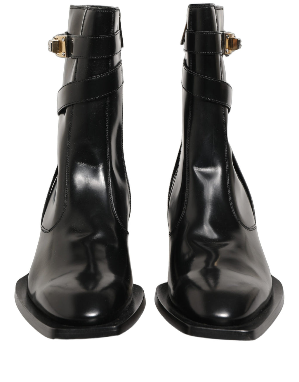 Bottes hautes en cuir noir Dolce & Gabbana avec plaque DG, semelle en cuir, style élégant et sophistiqué.