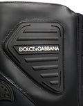 Bottes en cuir noir pour homme de style motard, mi-mollet, de la marque Dolce & Gabbana, avec détails en cuir et semelle robuste.