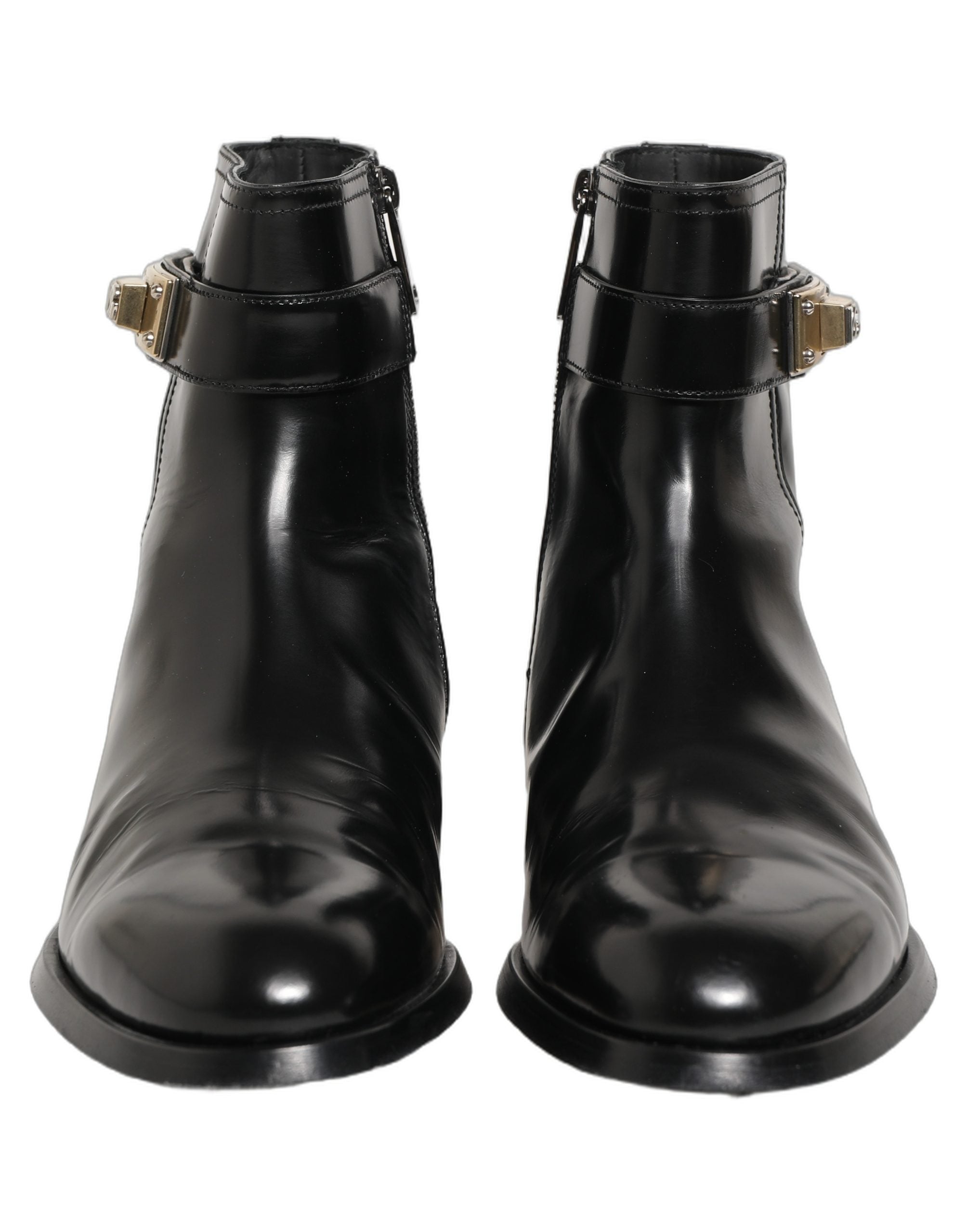 Bottes mi-mollet en cuir noir Dolce & Gabbana avec boucle logo, style élégant et tendance, vue de face sur fond neutre.