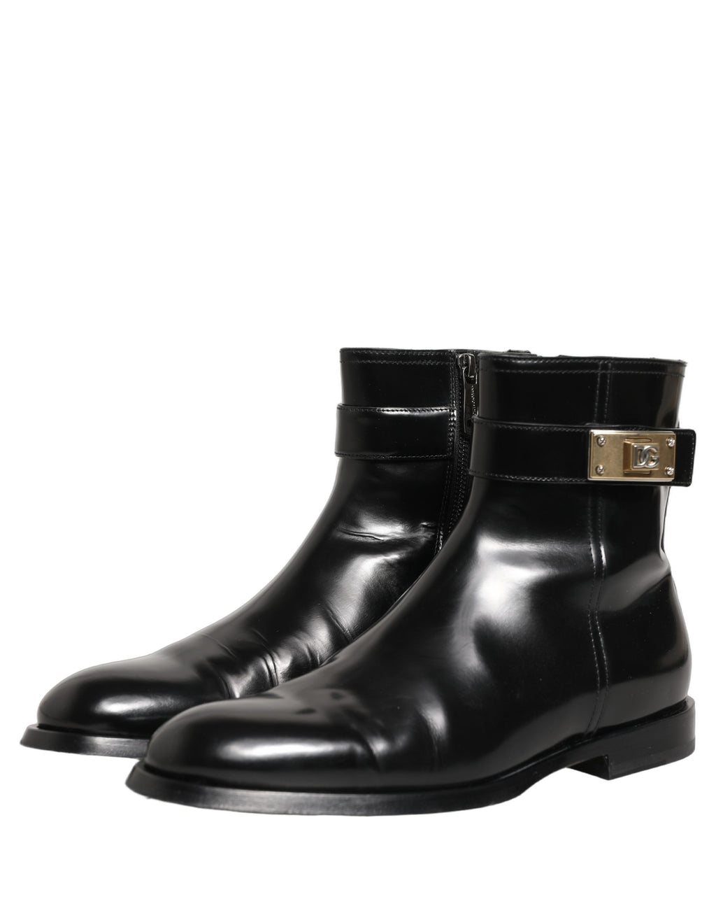 Bottes mi-mollet en cuir noir Dolce & Gabbana avec boucle logo, style élégant et moderne.