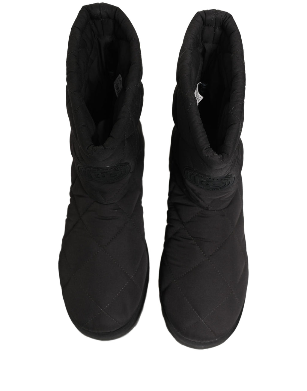 Bottes mi-mollet noires en effet matelassé de Dolce & Gabbana, chaussures élégantes et sophistiquées pour femmes.