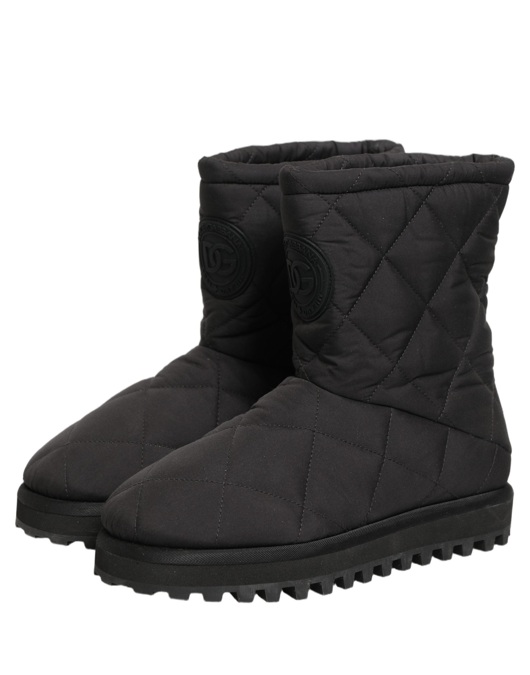 Bottes mi-mollet noires de la marque Dolce & Gabbana avec effet matelassé, en cuir, vues de face.