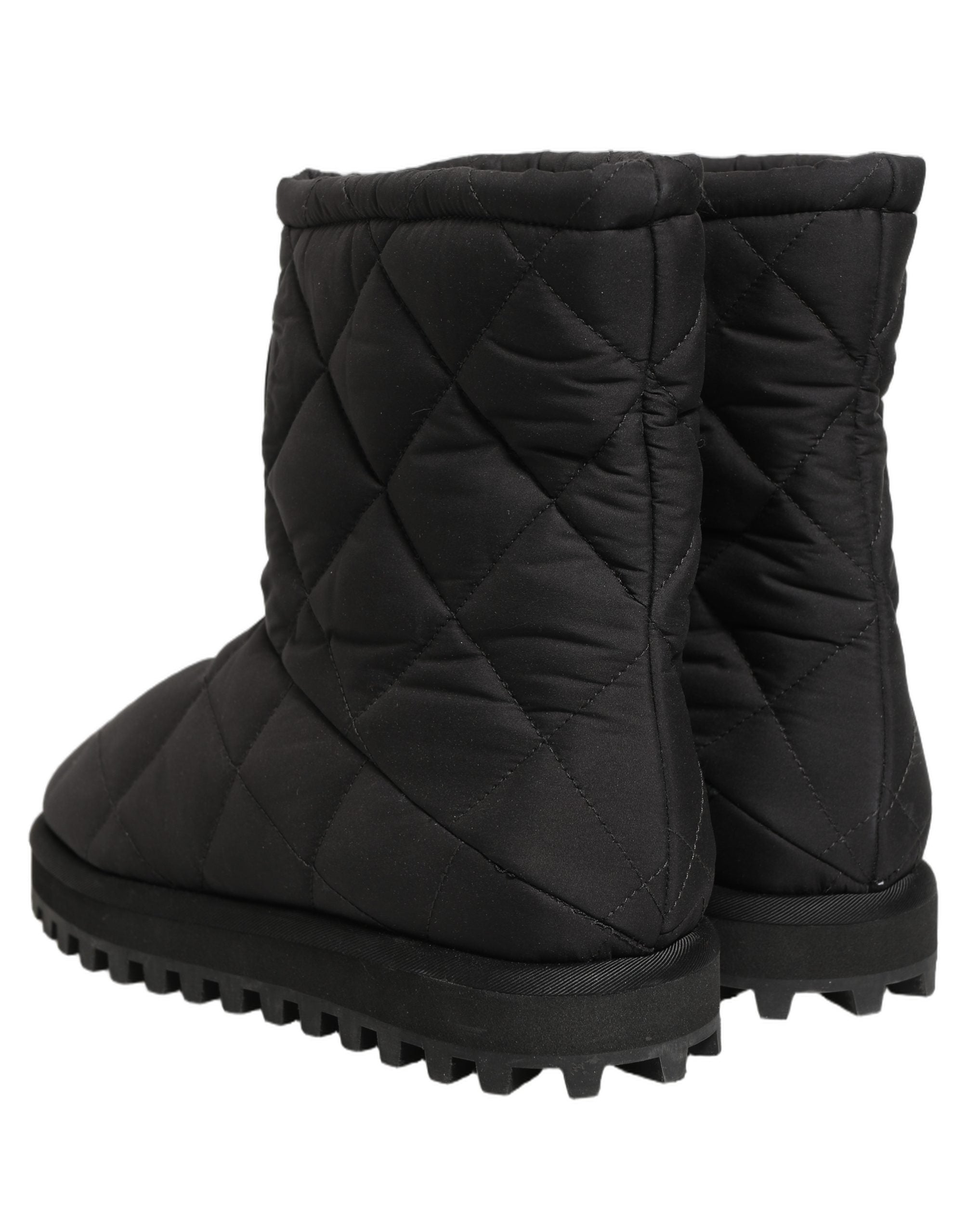 Bottes mi-mollet noires en cuir matelassé de Dolce & Gabbana, style élégant et sophistiqué.