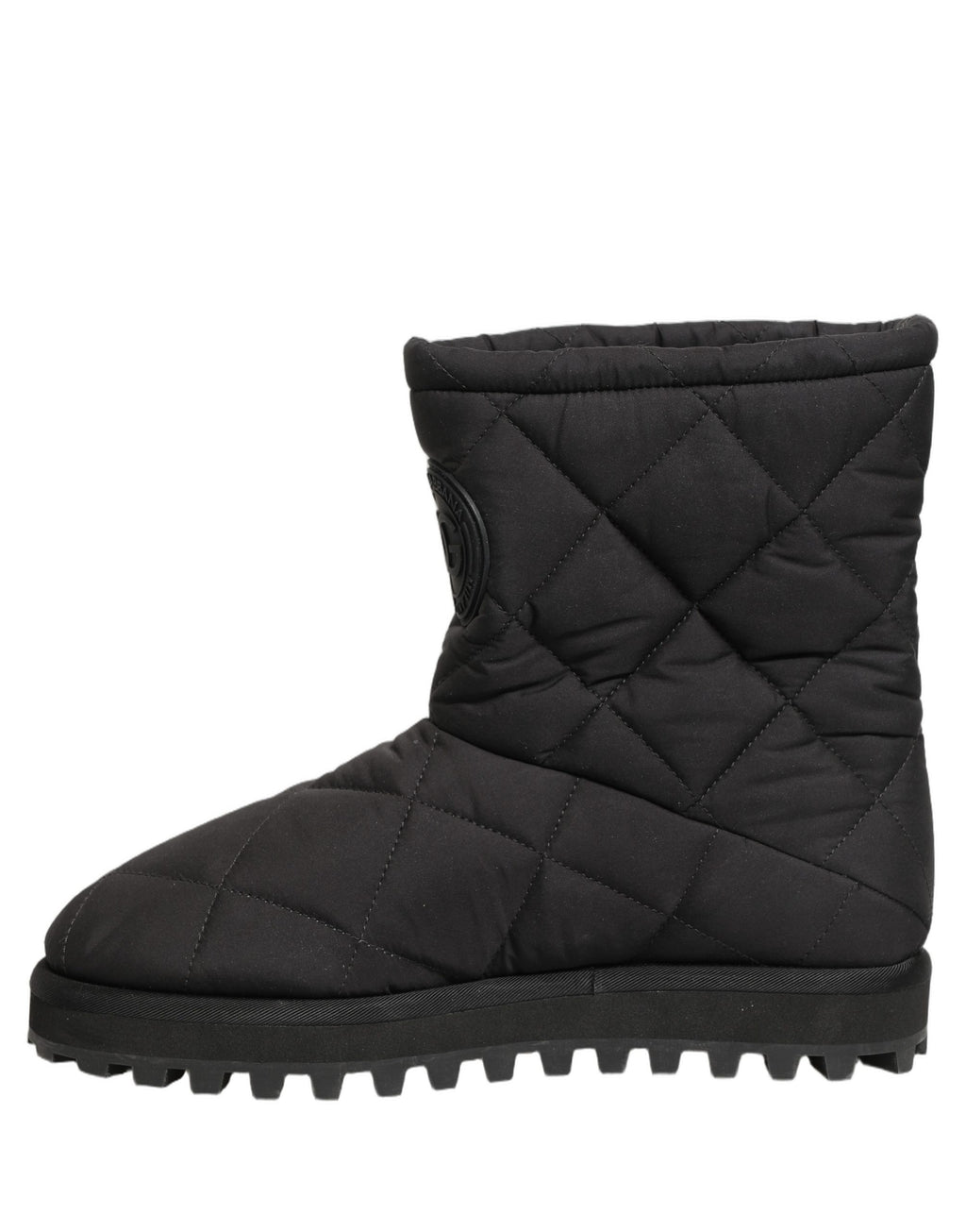 Bottes mi-mollet noires Dolce & Gabbana avec effet matelassé, semelle en cuir et design élégant.