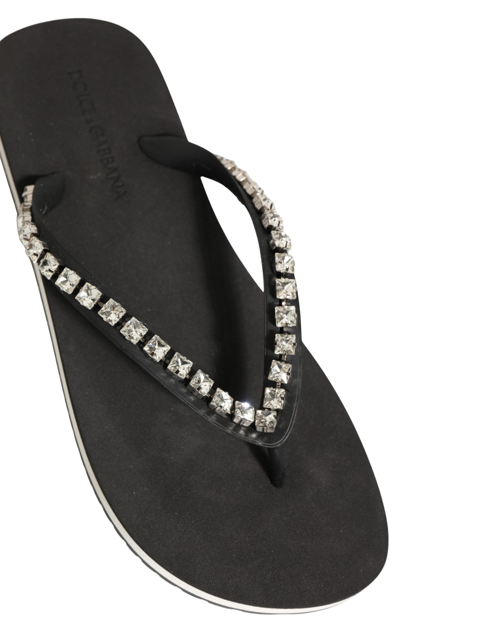 Tongs noires pour hommes Dolce & Gabbana en caoutchouc avec embellissements, semelle confortable et design élégant.