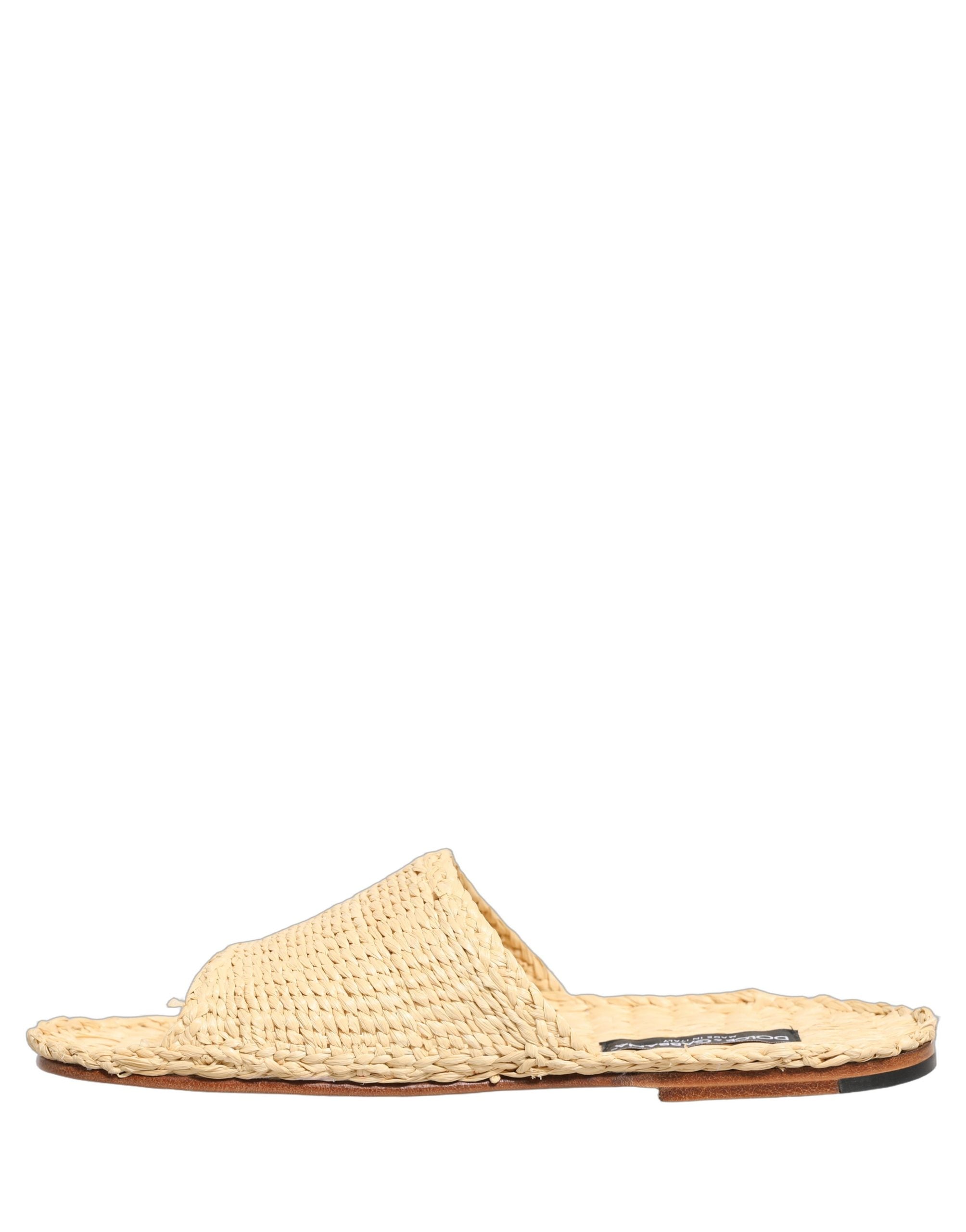 Sandales plates Dolce & Gabbana en raphia beige avec bride en paille, chaussures d'été élégantes et confortables.