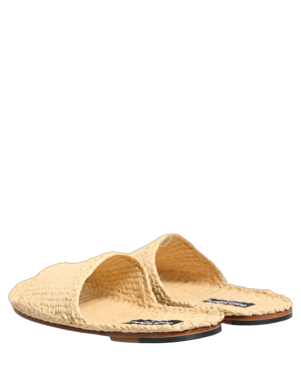 Sandales plates Dolce & Gabbana en paille beige avec bride en raphia, style élégant et confortable pour l'été.