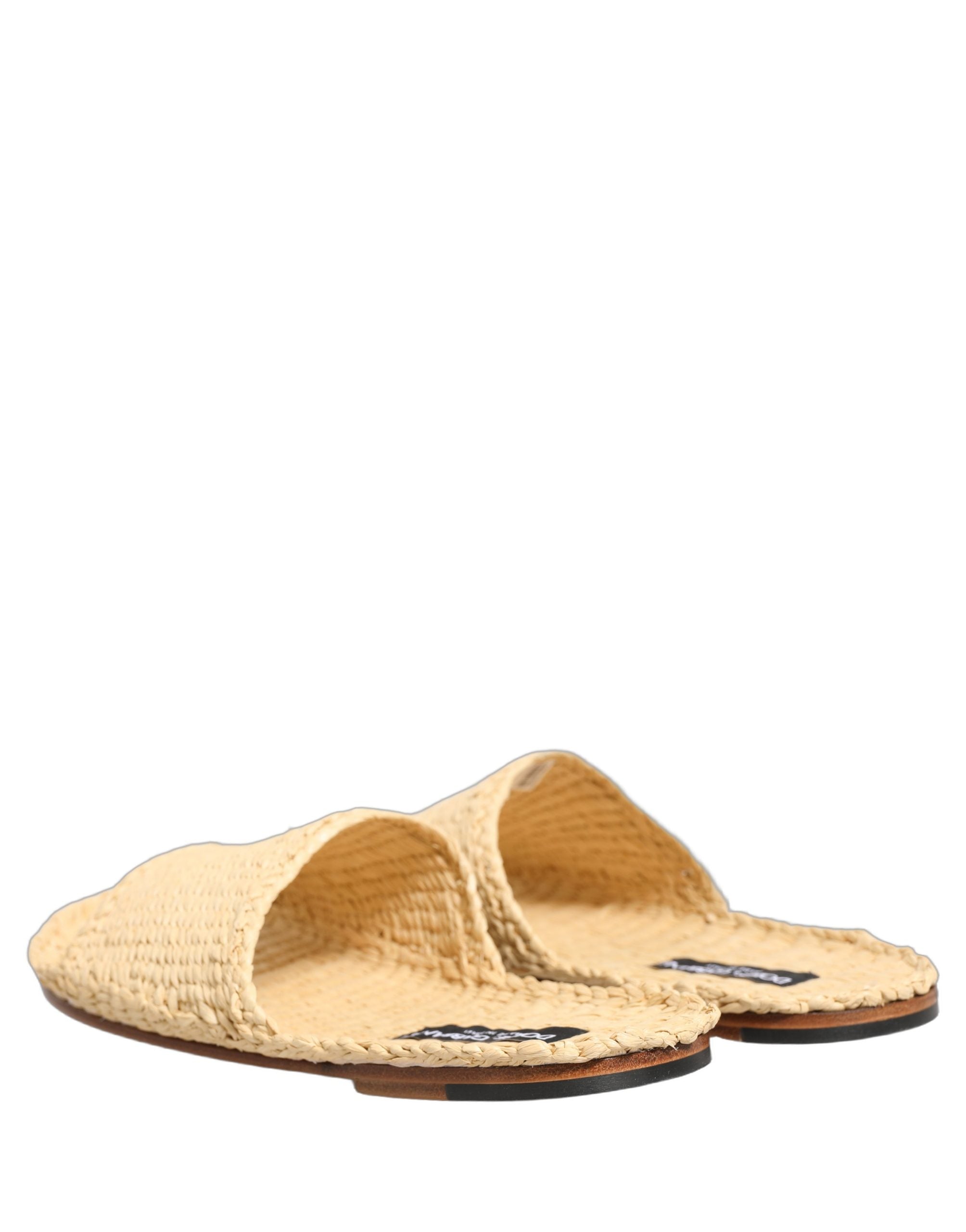 Sandales plates Dolce & Gabbana en paille beige avec bride en raphia, style élégant et confortable pour l'été.