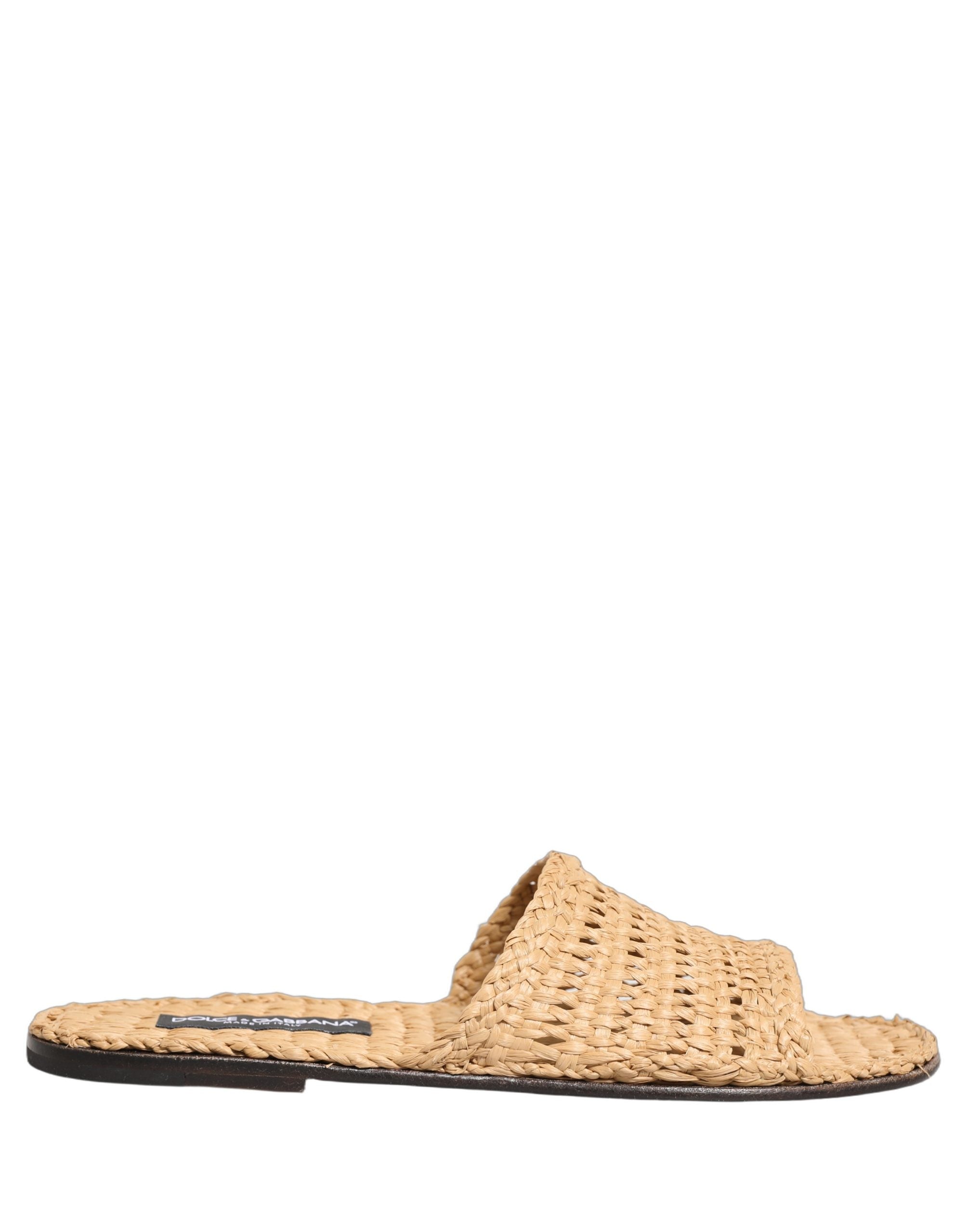 Sandales plates Dolce & Gabbana en raphia beige avec bandes croisées et semelle en caoutchouc.