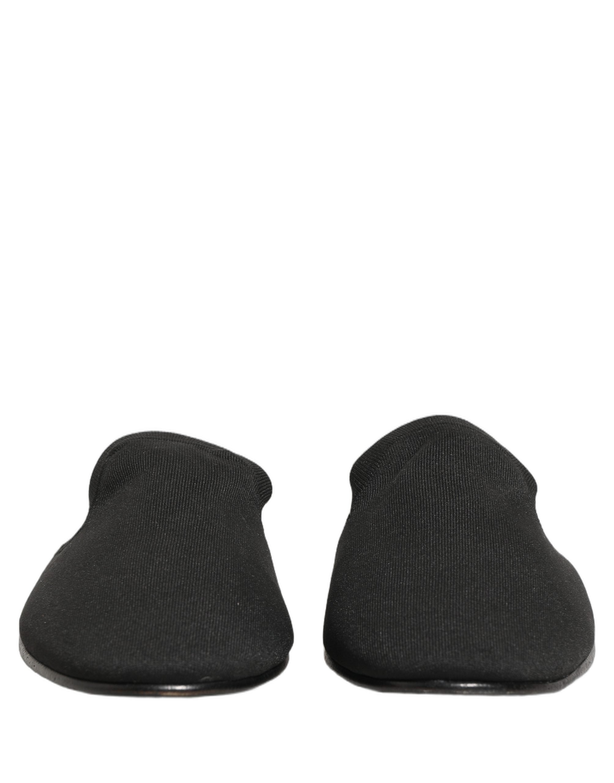 Mules en daim noir Dolce & Gabbana pour homme, chaussures plates élégantes et confortables, vue de côté.