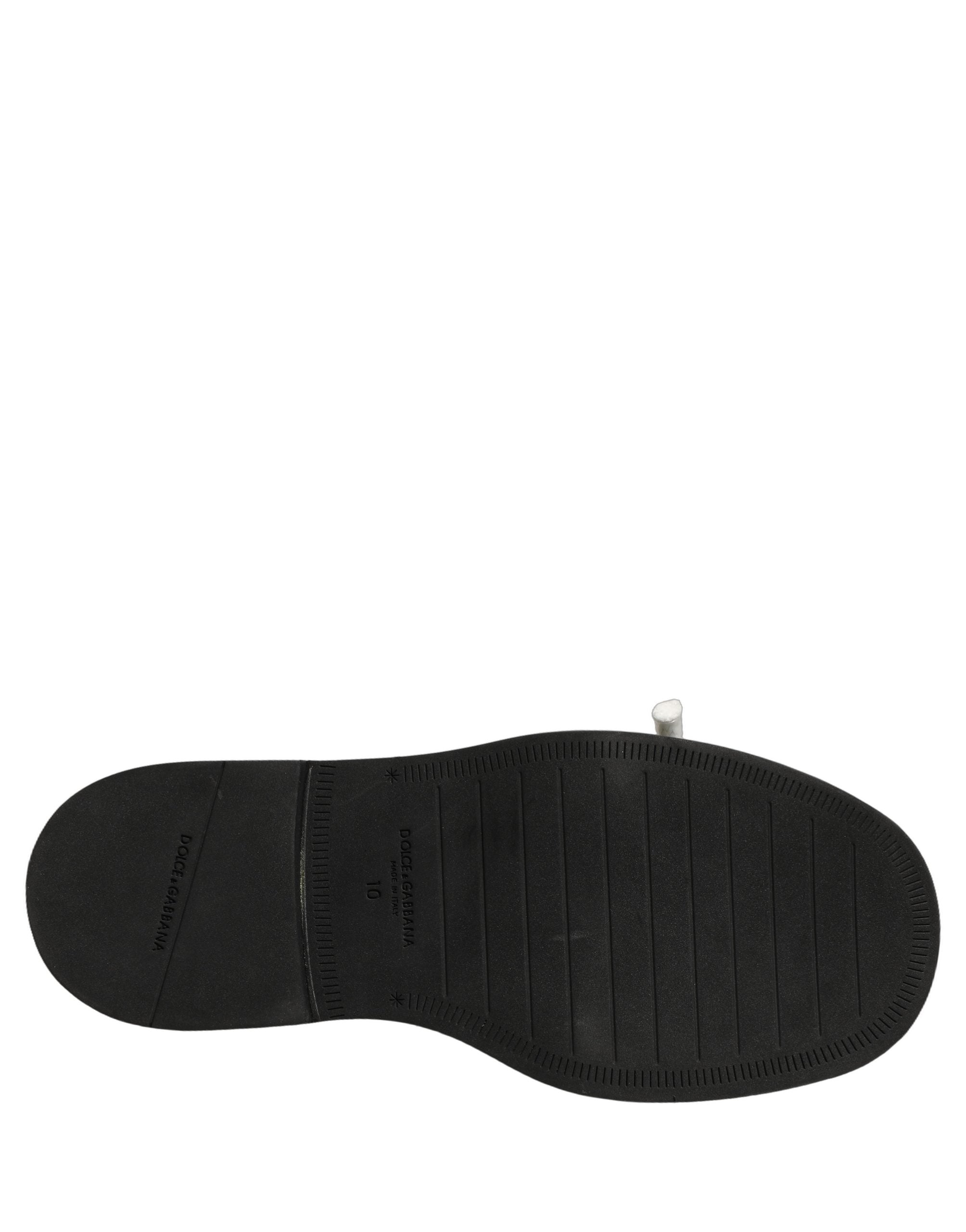 Sandales plates en cuir marron Dolce & Gabbana pour hommes, chaussures slip-on élégantes et confortables.