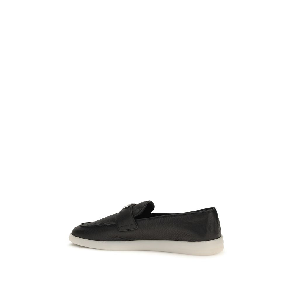 Chaussures Prada Bos Taurus en cuir de veau noir, mocassins slip-on élégants pour homme, finition raffinée et style sophistiqué